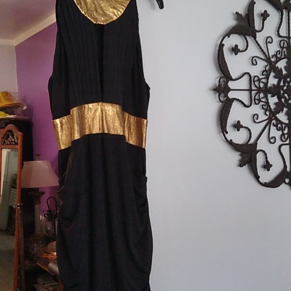 Black knit a leather dress. Has rushing on each side and back.